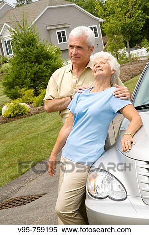 Stock Photography - Senior couple at residential area. Fotosearch