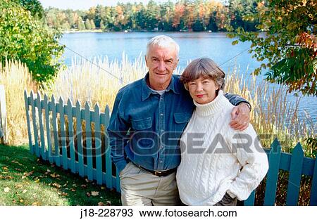 Stock Image - Senior couple, autumn. Gatineau Park. Quebec. Canada. Fotosearch