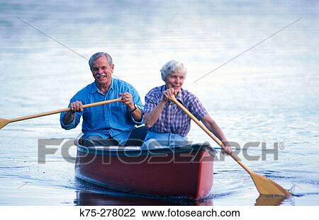 Senior couple canoeing View Large Photo Image Stock Image - Senior couple canoeing. Fotosearch