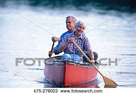 Senior couple canoeing View Large Photo Image Stock Image - Senior couple canoeing. Fotosearch