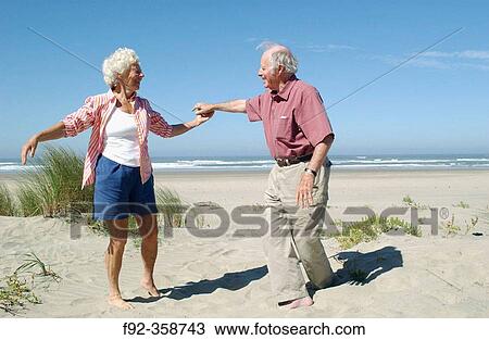 Senior couple dancing on the beach View Large Photo Image Stock Image - Senior couple dancing on the beach. Fotosearch