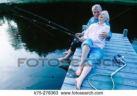 Senior couple fishing and laughing View Large Photo Image Stock Image - Senior couple fishing and laughing. Fotosearch