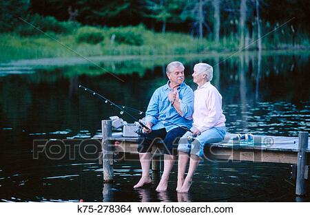 Picture - Senior couple fishing on a dock. Fotosearch