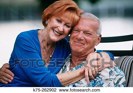 Stock Image - Senior couple happy and hugging. Fotosearch