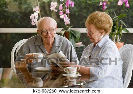 Senior couple having coffee or tea together View Large Photo Image Stock Image - Senior couple having coffee or tea together. Fotosearch