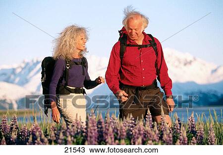 Senior couple hiking. Chugach National Forest. Alaska. USA View Large Photo Image Stock Image - Senior couple hiking. Chugach National Forest. Alaska. USA. Fotosearch