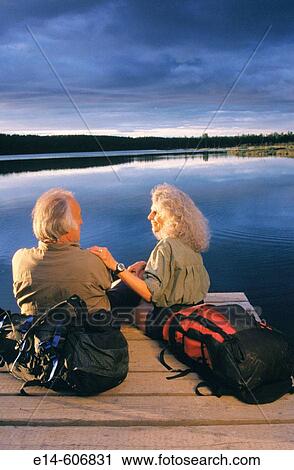 Senior couple hiking. Otter Lake. Alaska. USA View Large Photo Image Stock Image - Senior couple hiking. Otter Lake. Alaska. USA. Fotosearch