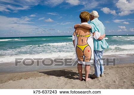 Senior couple hugging, wife wearing humorous tee shirt View Large Photo Image Stock Image - Senior couple hugging, wife wearing humorous tee shirt. Fotosearch