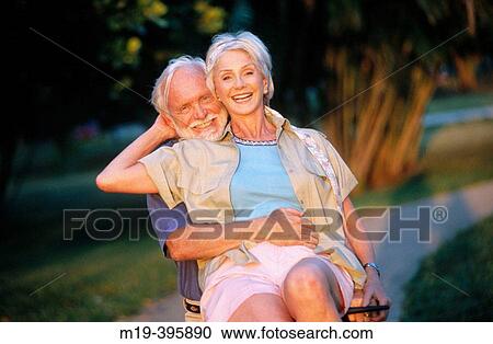 senior couple on a bike View Large Photo Image Stock Image - senior couple on a bike. Fotosearch