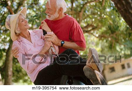senior couple on a tire swing View Large Photo Image Picture - senior couple on a tire swing. Fotosearch