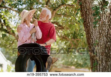 senior couple on a tire swing View Large Photo Image Stock Image - senior couple on a tire swing. Fotosearch