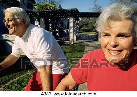 Senior couple riding bikes View Large Photo Image Stock Image - Senior couple riding bikes. Fotosearch