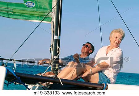 senior couple sailing a katamaran View Large Photo Image Stock Image - senior couple sailing a katamaran. Fotosearch