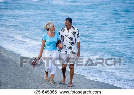 senior couple strolling along the beach View Large Photo Image Stock Photography - senior couple strolling along the beach. Fotosearch