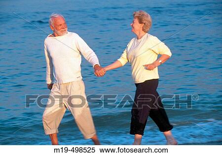 senior couple strolling on the beach View Large Photo Image Stock Photography - senior couple strolling on the beach. Fotosearch