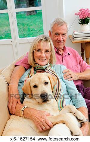 Senior couple with dog View Large Photo Image Picture - Senior couple with dog. Fotosearch