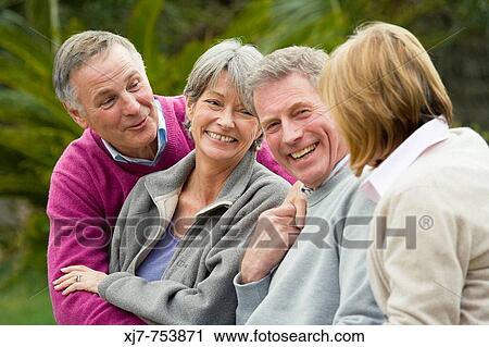 Stock Image - Senior couples having fun together. Fotosearch