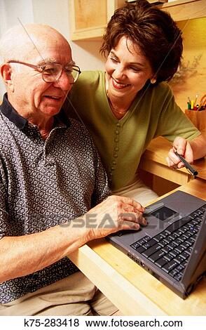 Senior learning to use computer View Large Photo Image Stock Photo - Senior learning to use computer. Fotosearch