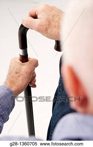 Senior man detail seen from behind waiting with his hand on a crutch in a clinic waiting room or medical center View Large Photo Image Stock Photography - Senior man detail seen from behind waiting with his hand on a crutch in a clinic waiting room or medical center. Fotosearch