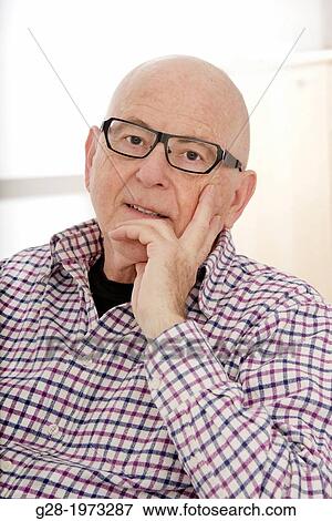 Senior Man head in chin wearing spectacles, thoughtful mood View Large Photo Image Stock Photo - Senior Man head in chin wearing spectacles, thoughtful mood. Fotosearch