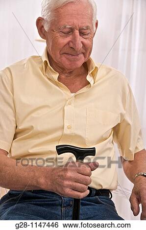 Senior man Holding a Walking stick View Large Photo Image Stock Photograph - Senior man Holding a Walking stick. Fotosearch