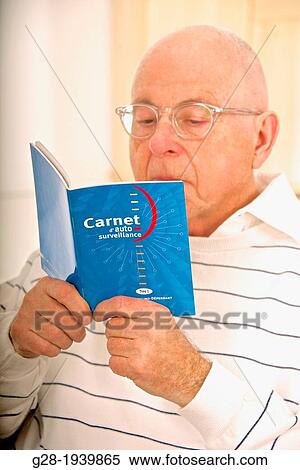 Senior man reading and controlling his diabetes results on his self testing blue booklet View Large Photo Image Stock Photography - Senior man reading and controlling his diabetes results on his self testing blue booklet. Fotosearch