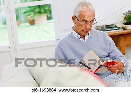 Picture - Senior man reading book. Fotosearch