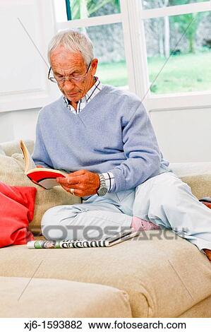 Senior man reading book View Large Photo Image Stock Image - Senior man reading book. Fotosearch