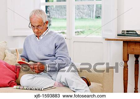 Senior man reading book View Large Photo Image Stock Image - Senior man reading book. Fotosearch