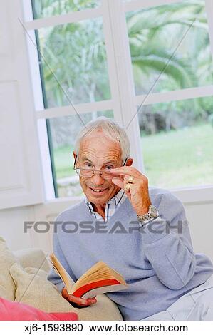 Senior man reading book View Large Photo Image Stock Image - Senior man reading book. Fotosearch