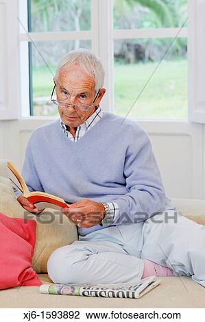 Senior man reading book View Large Photo Image Stock Image - Senior man reading book. Fotosearch