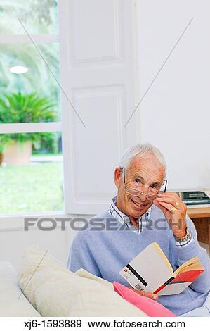 Stock Photo - Senior man reading book. Fotosearch