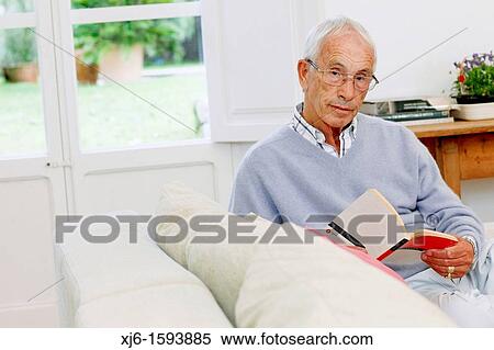 Senior man reading book View Large Photo Image Stock Photography - Senior man reading book. Fotosearch