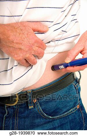 Senior man using an insulin pen for an injection against Diabetes detail close up View Large Photo Image Stock Image - Senior man using an insulin pen for an injection against Diabetes detail close up. Fotosearch