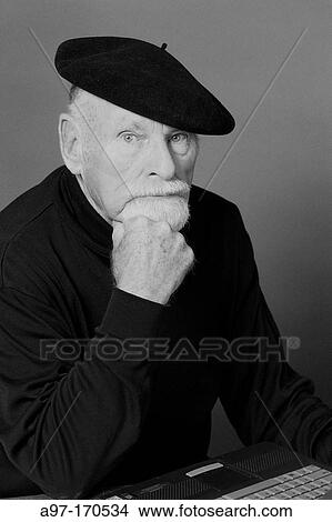 Senior man wearing beret using computer View Large Photo Image Picture - Senior man wearing beret using computer. Fotosearch