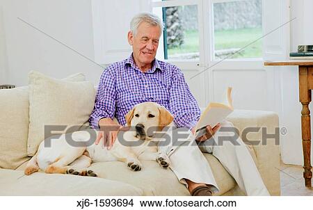 Senior man with dog View Large Photo Image Picture - Senior man with dog. Fotosearch