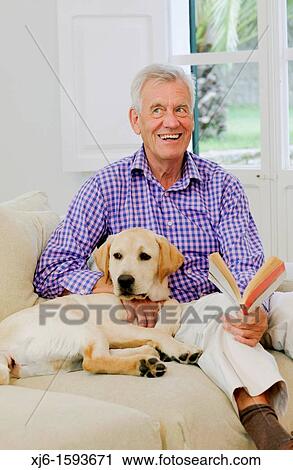 Stock Image - Senior man with dog. Fotosearch