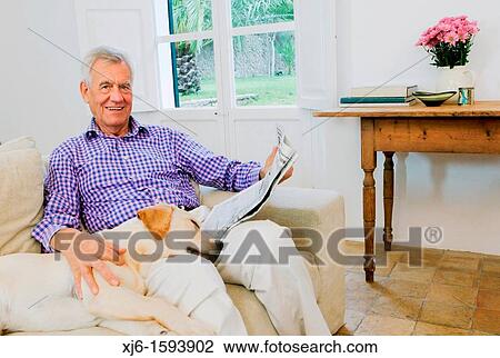 Stock Image - Senior man with dog. Fotosearch