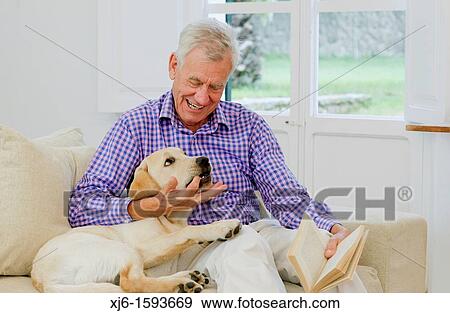Stock Photo - Senior man with dog. Fotosearch