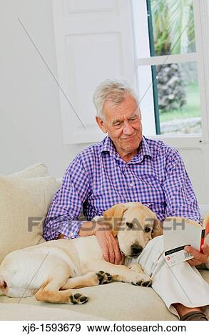Stock Photo - Senior man with dog. Fotosearch