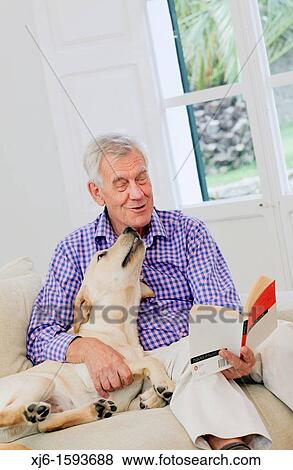 Stock Photo - Senior man with dog. Fotosearch