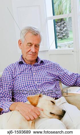 Stock Photo - Senior man with dog. Fotosearch