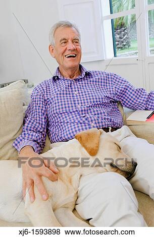 Senior man with dog View Large Photo Image Stock Photo - Senior man with dog. Fotosearch