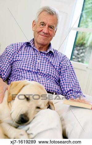 Senior man with dog View Large Photo Image Stock Photo - Senior man with dog. Fotosearch