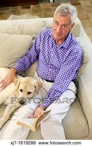 Senior man with dog View Large Photo Image Stock Photograph - Senior man with dog. Fotosearch