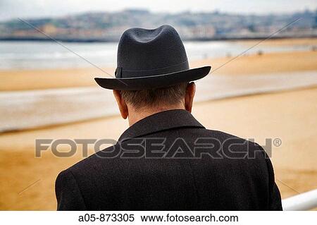 Senior man with hat at San Lorenzo beach, Gijon, Asturias, Spain View Large Photo Image Stock Photography - Senior man with hat at San Lorenzo beach, Gijon, Asturias, Spain. Fotosearch