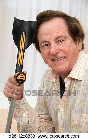 senior man with his hands resting on his crutch View Large Photo Image Stock Photo - senior man with his hands resting on his crutch. Fotosearch