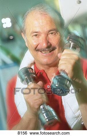 Stock Photograph - Senior man with weights. Fotosearch