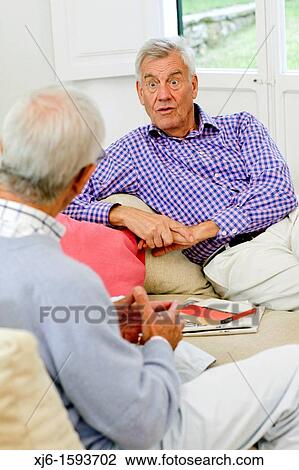 Stock Image - Senior men, chatting. Fotosearch