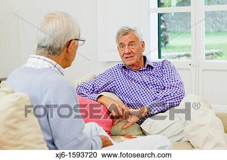 Stock Image - Senior men, chatting. Fotosearch